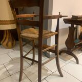 Antique straw-covered high chair