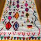 Berber carpet azimuth colored white with multicolored and fluorescent patterns