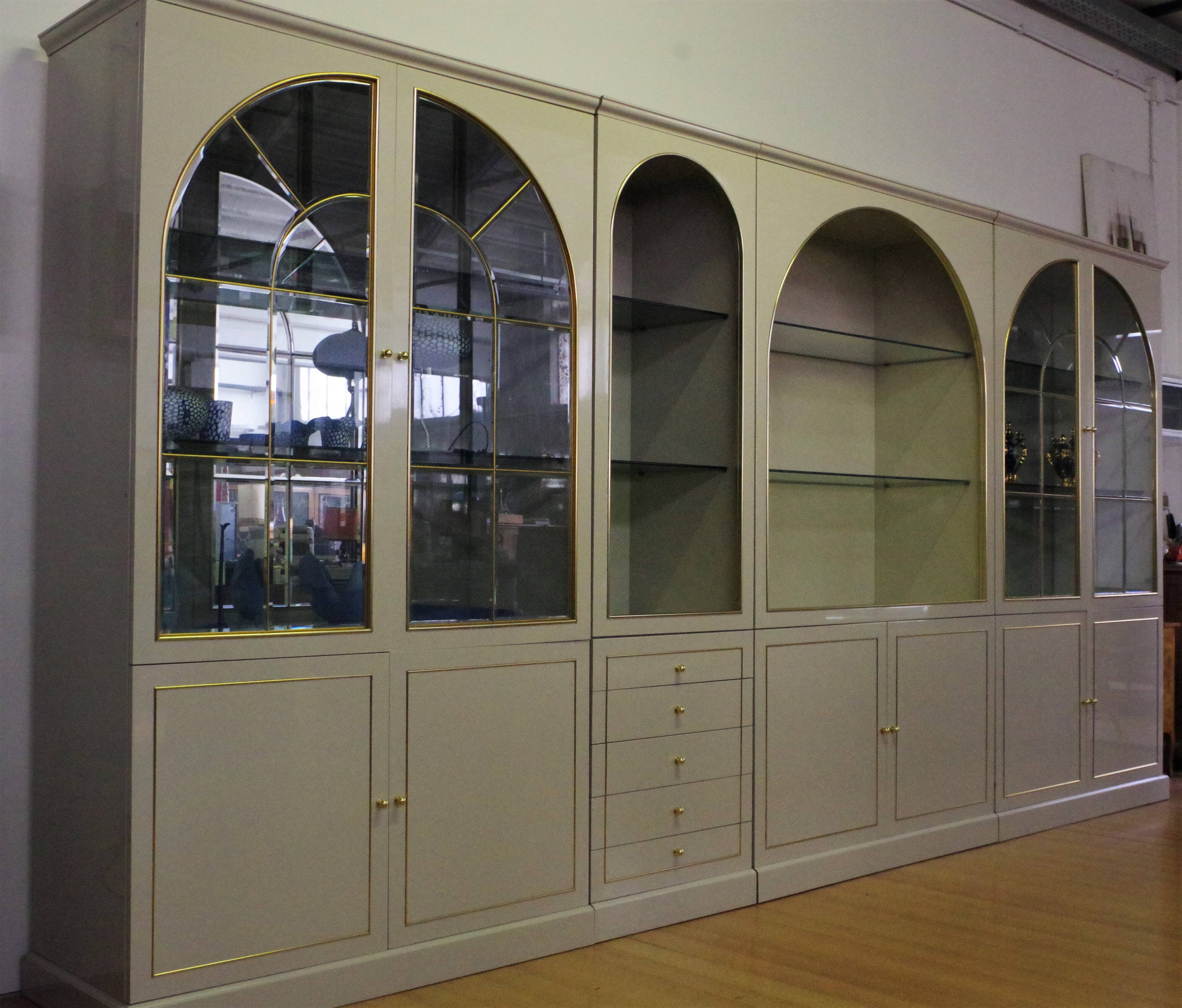 Showcases in lacquered wood, glass and brass  1970s, set of 4