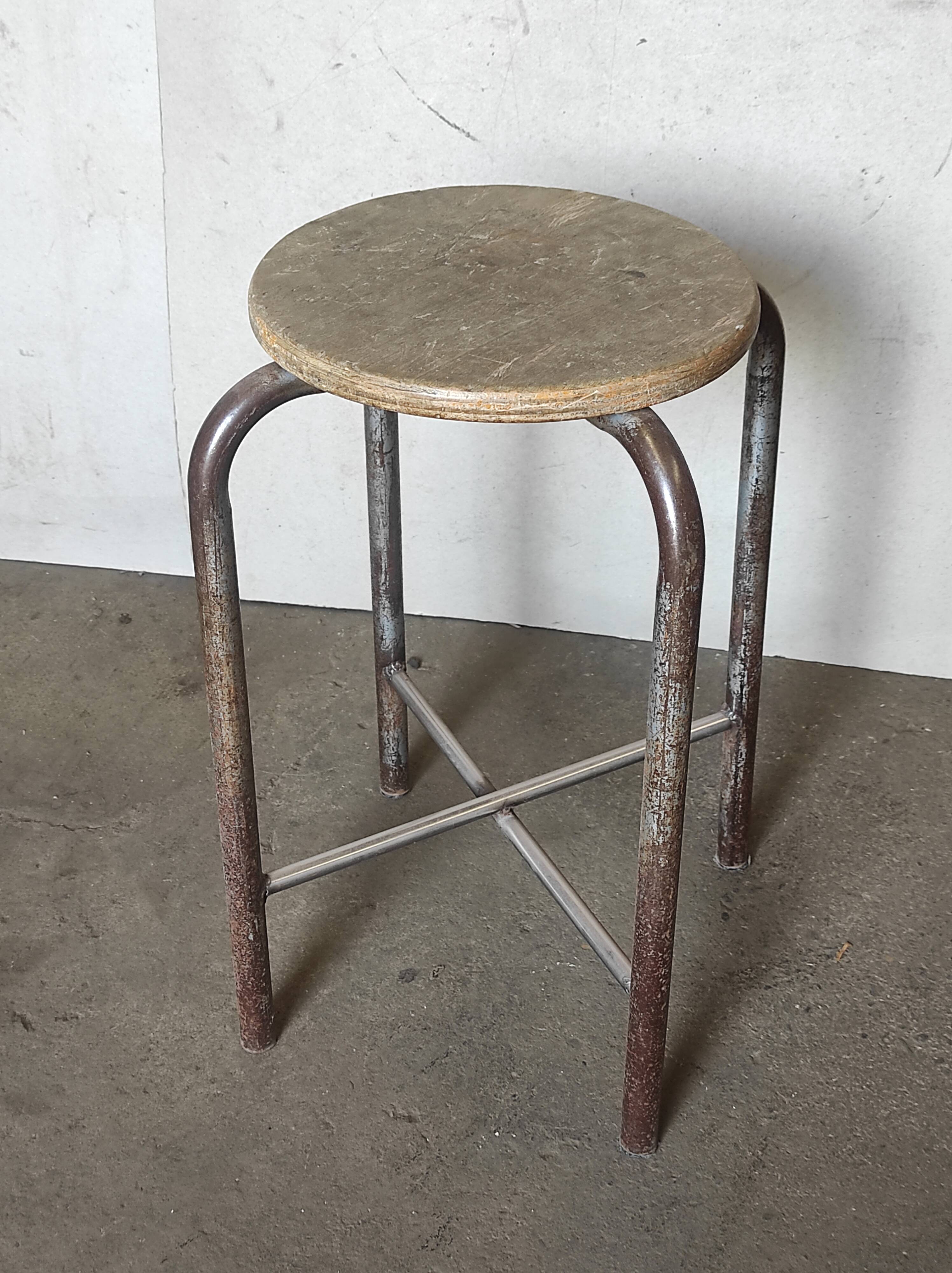 Old vintage metal and wood industrial workshop stool