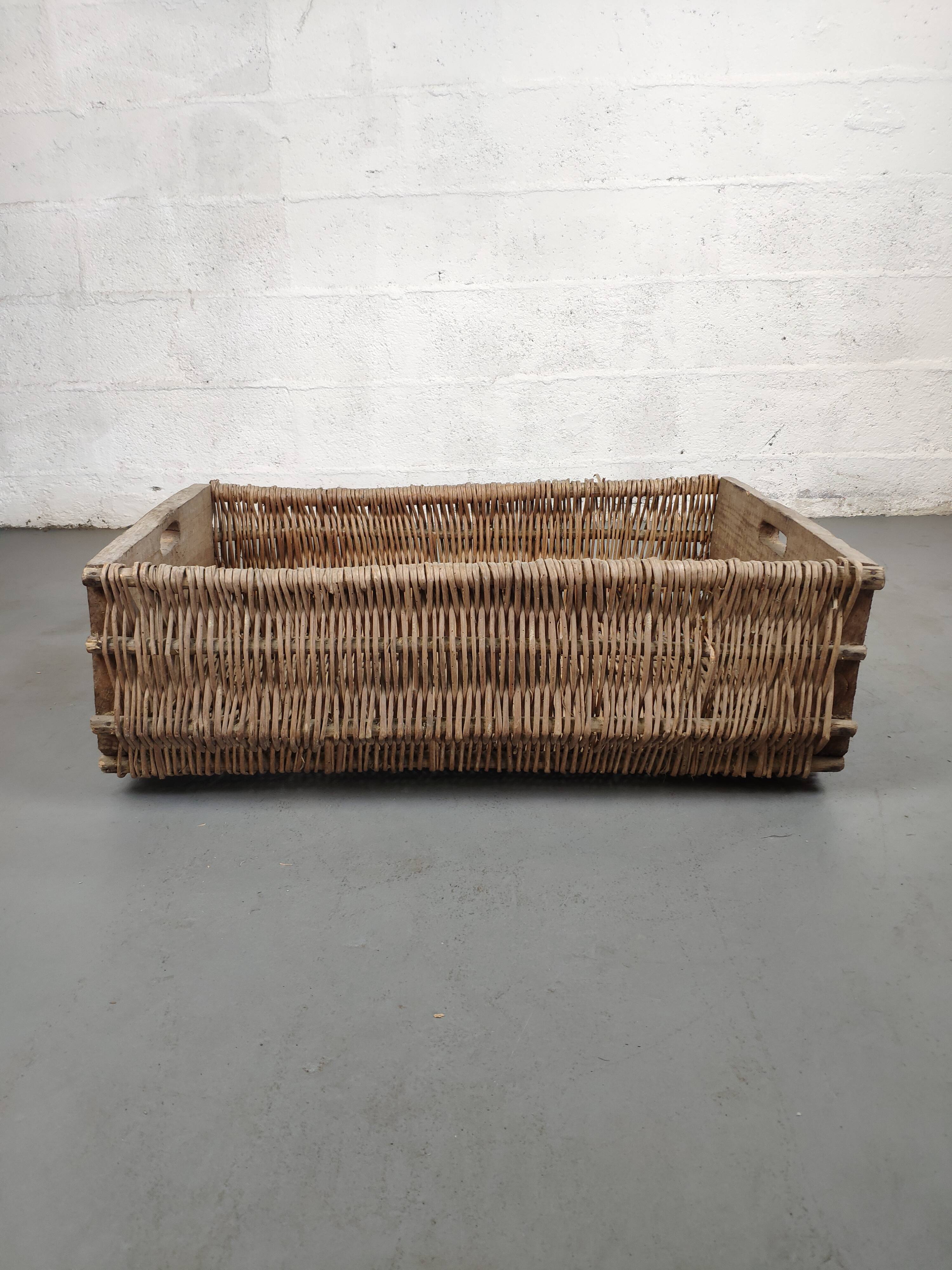 Set of 2 old large baskets with logs wood and wicker