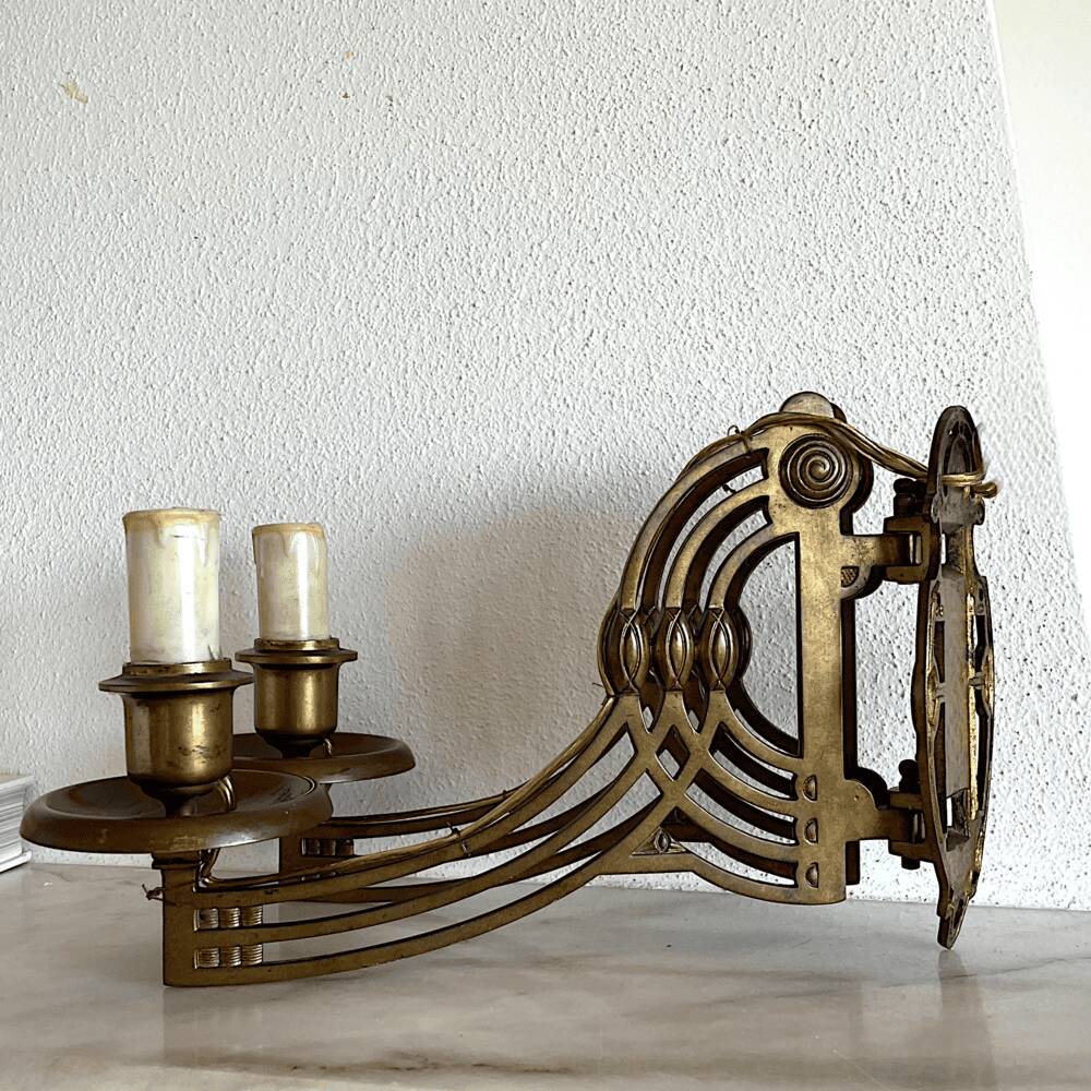 Art Nouveau style brass double piano wall lamp