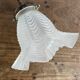 Antique swan neck wall light in brass and porcelain with a glass shade.