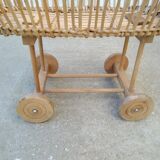 Rattan cradle for doll on vintage wheels