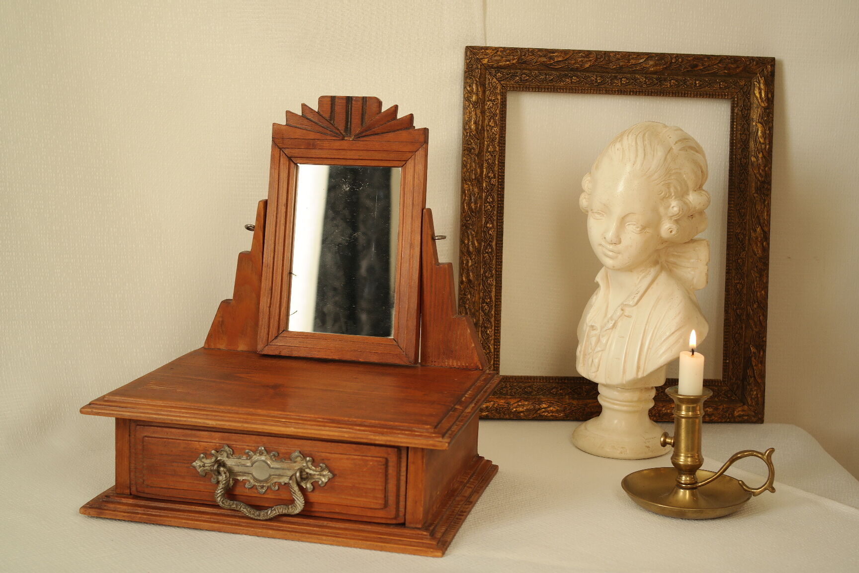 Antique wooden table mirror in Art Deco style.