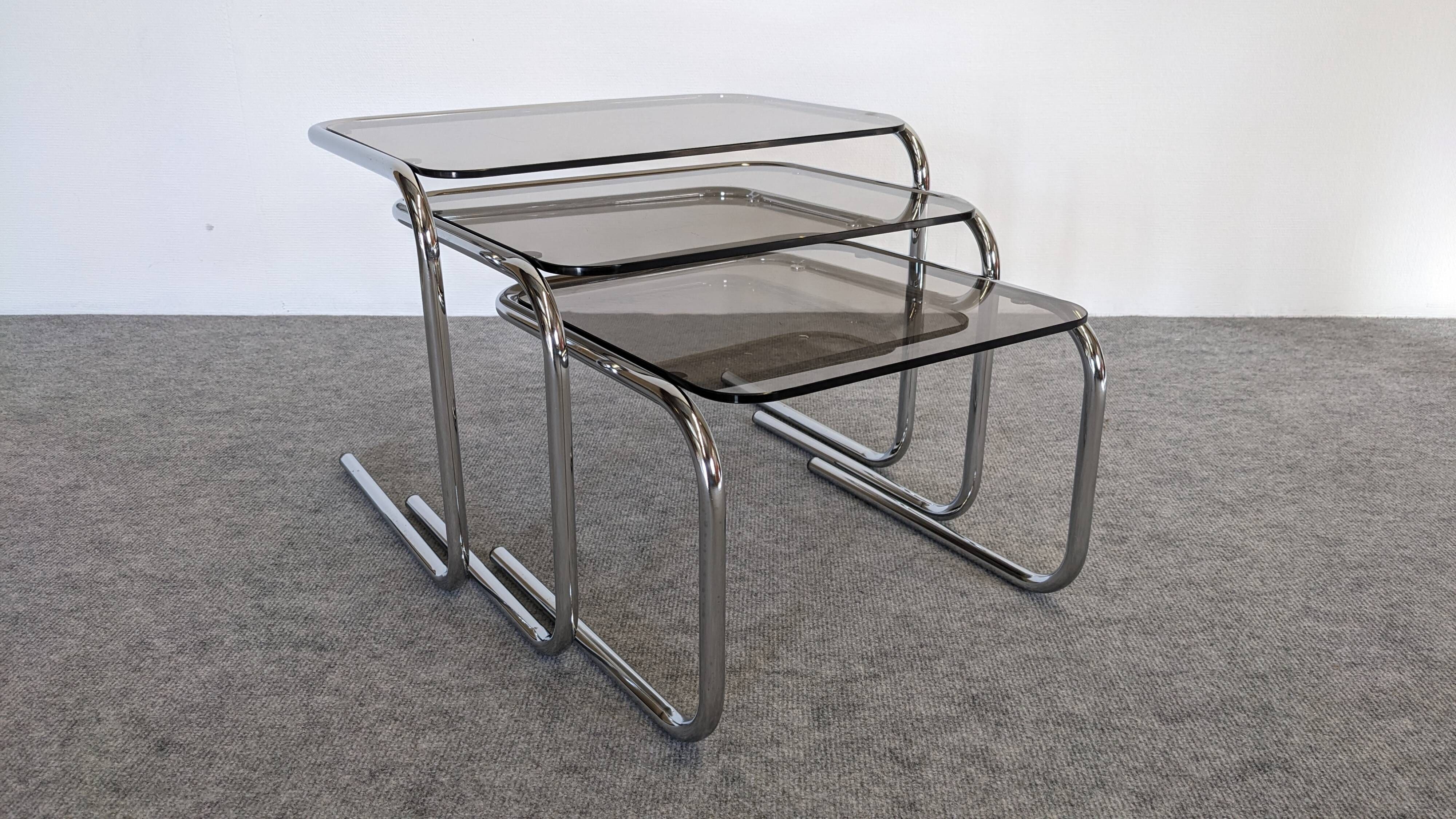 Nested tables with tubular chrome and smoked glass, France 1970.