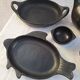 Black terracotta dinnerware set from La Chamba in Colombia. Set of 13 pieces.