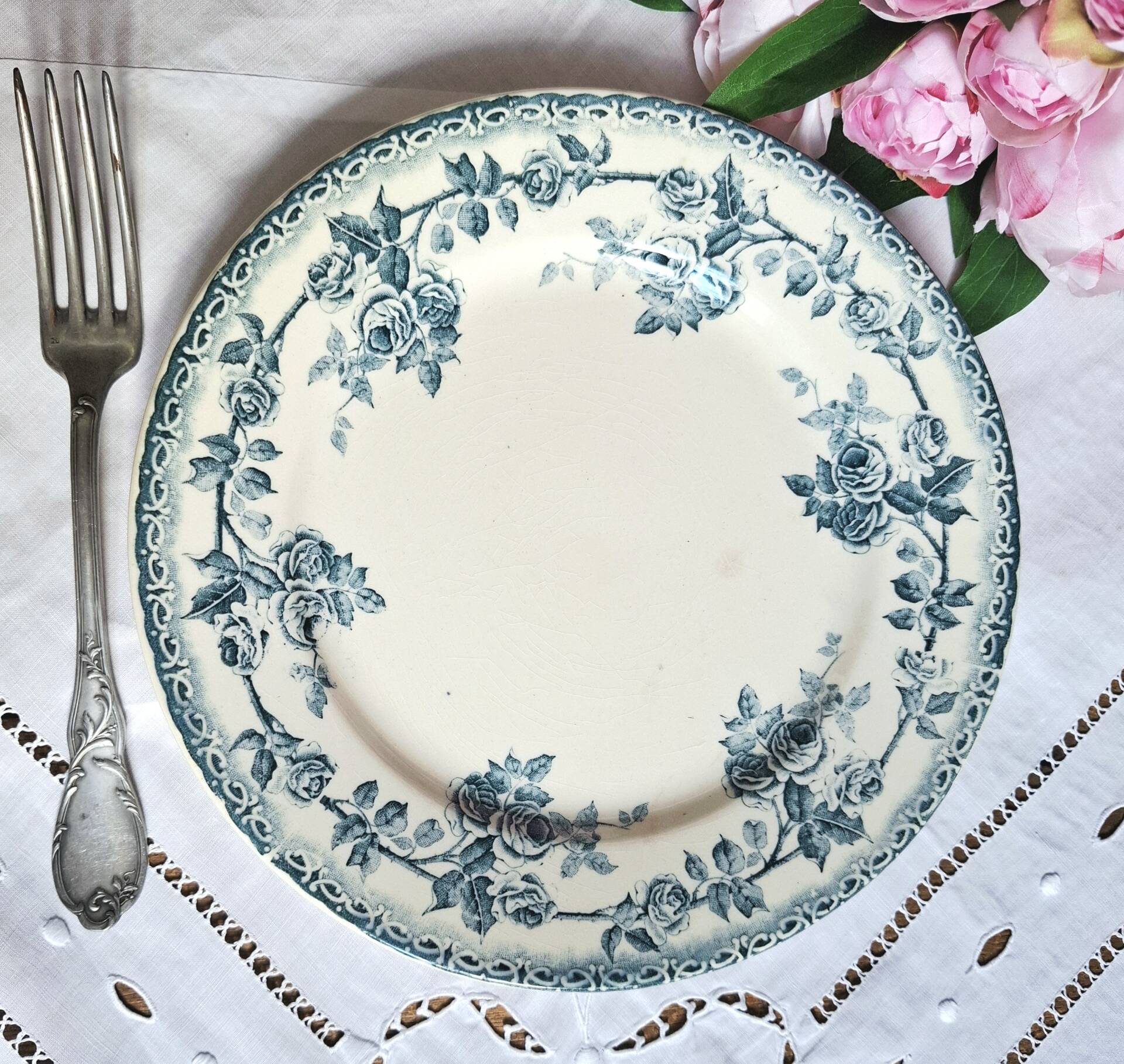 Old mismatched flat plates made of ironstone earthenware.