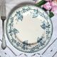Old mismatched flat plates made of ironstone earthenware.