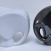 Two iridescent black and white ceramic elephants design