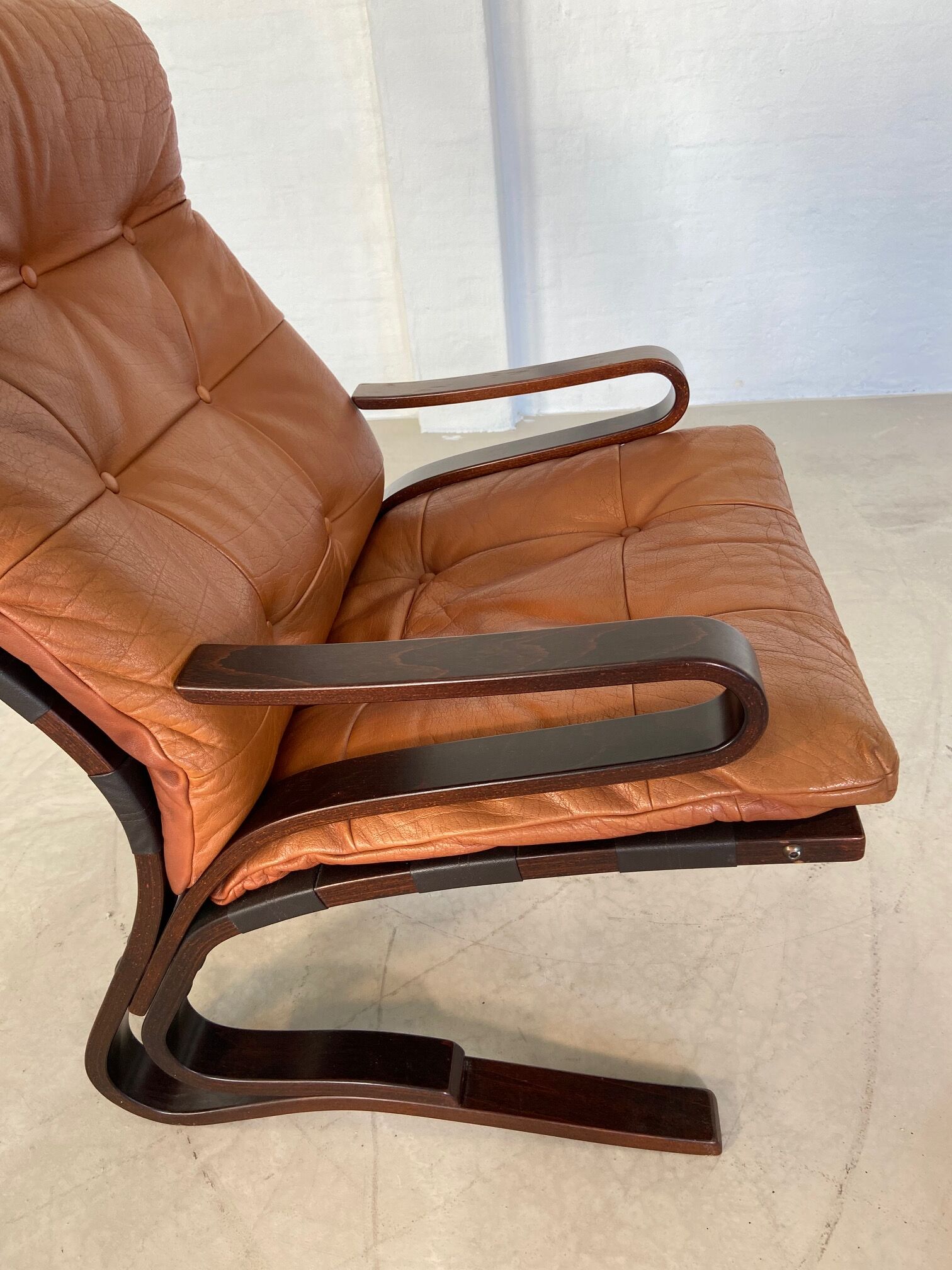 Vintage Scandinavian cognac lounge chair by Oddvin Rykken