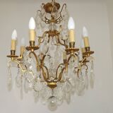 French Louis XV chandelier with 8 lights in gilded bronze, glass and crystal.