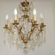 French Louis XV chandelier with 8 lights in gilded bronze, glass and crystal.