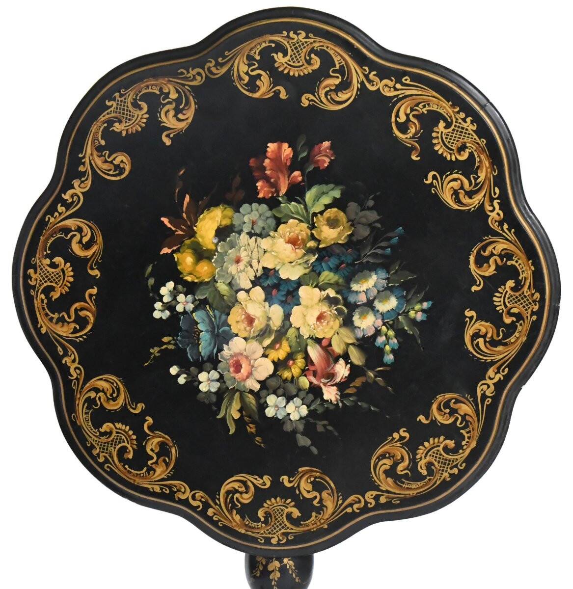 Blackened wooden side table decorated with a painted bouquet of flowers.