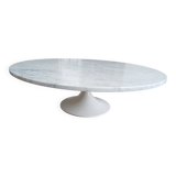 Round marble coffee table with tulip base.