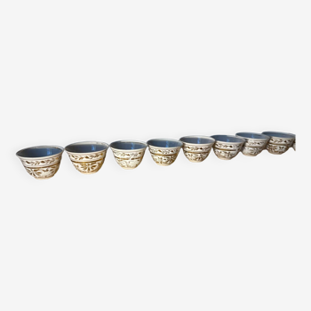 Set of gold patterned cups