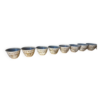 Set of gold patterned cups