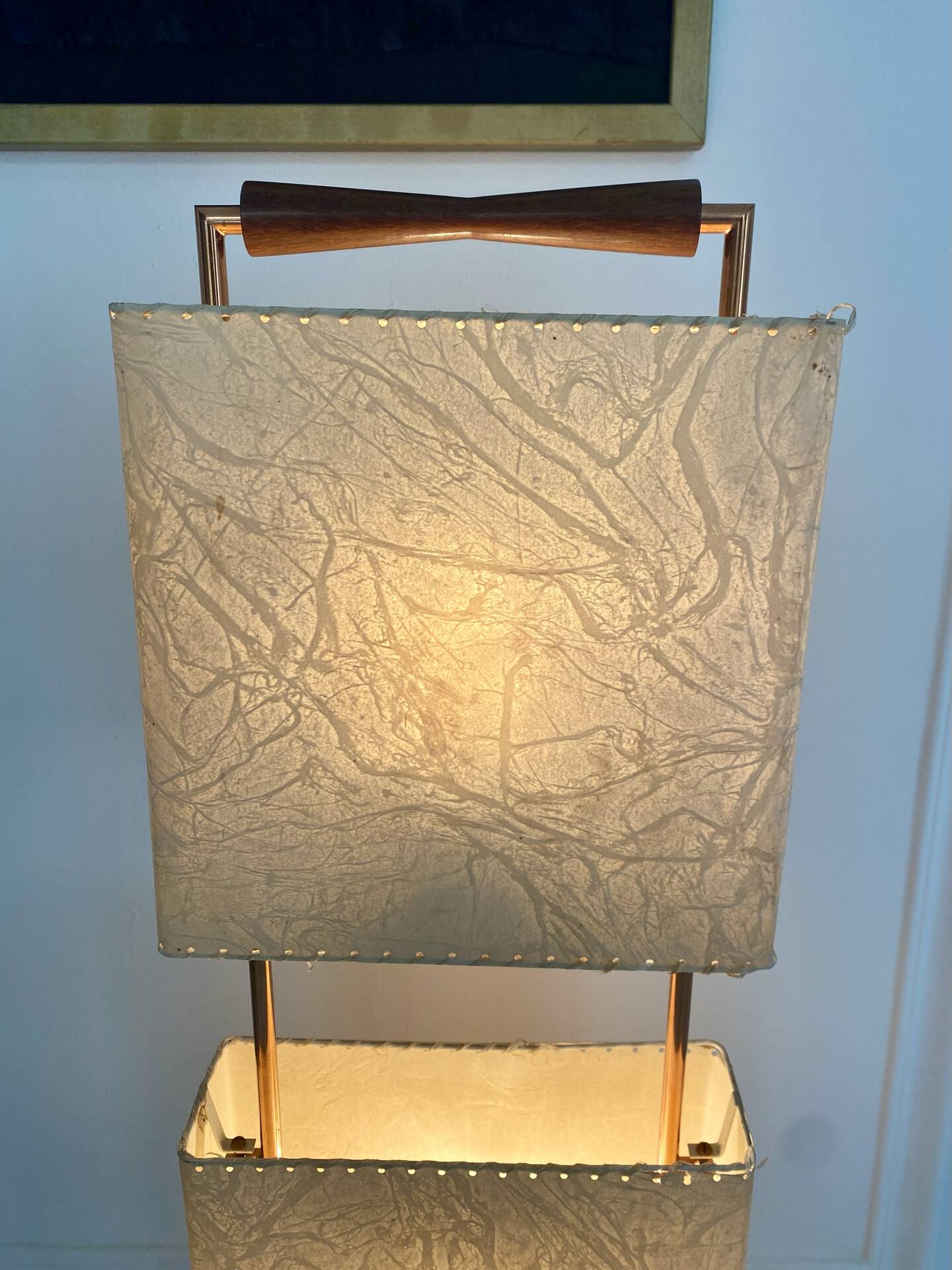 Wood and copper metal floor lamp with parchment.