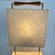 Wood and copper metal floor lamp with parchment.