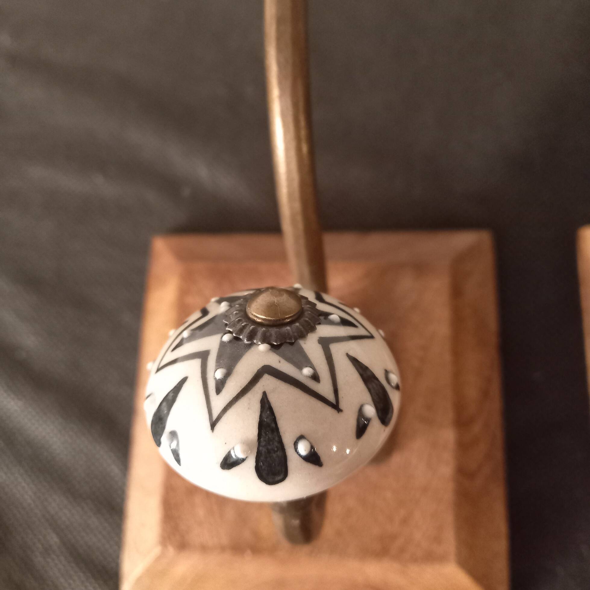 Duo of coat hooks, coat racks in wood and bronze porcelain