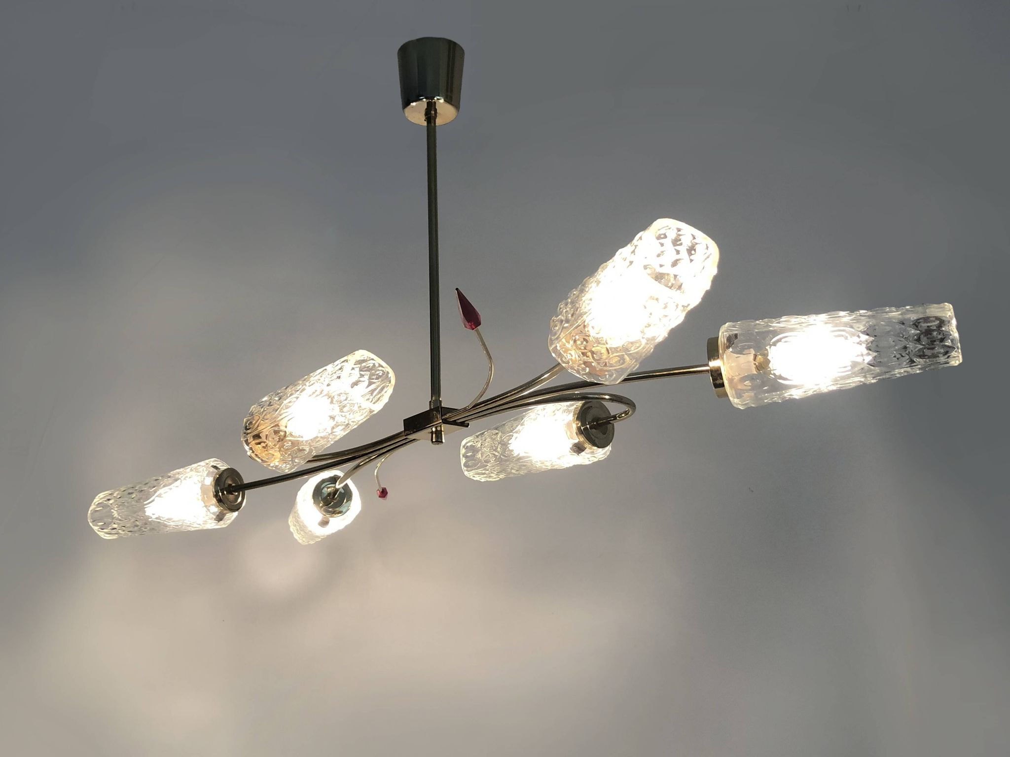 Antique chandelier with 6 branches, 2 red arrows, brass and diamond glass tubes. 70s
