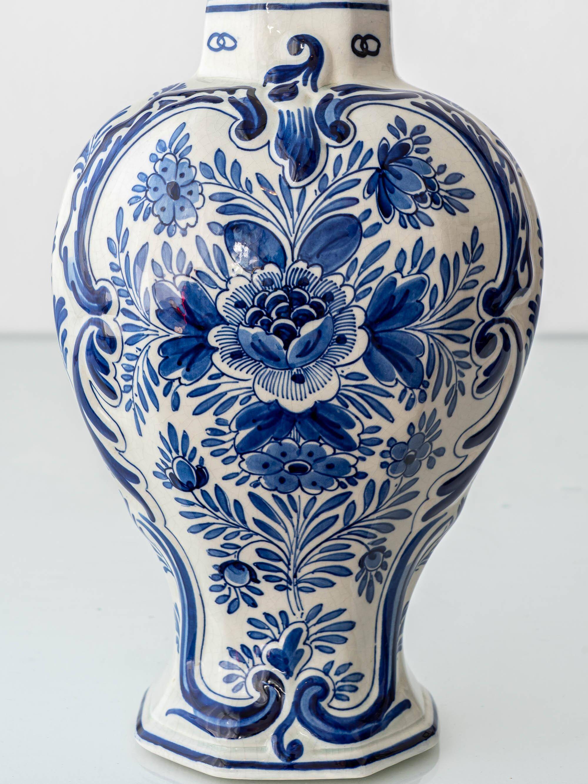 Pair of Royal Delft blue and white ceramic table lamps, 1905, with new pleated silk shades.