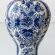 Pair of Royal Delft blue and white ceramic table lamps, 1905, with new pleated silk shades.