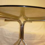 Table vintage 70 en verre légèrement fumé pieds chromés