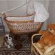 Vintage wicker cradle on wheels from the 1970s.