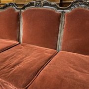 Baroque living room in burgundy velvet and wood