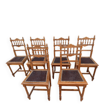 Set of 6 antique turned wooden chairs with embossed leather seats.