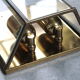 Wall sconce in brass and glass