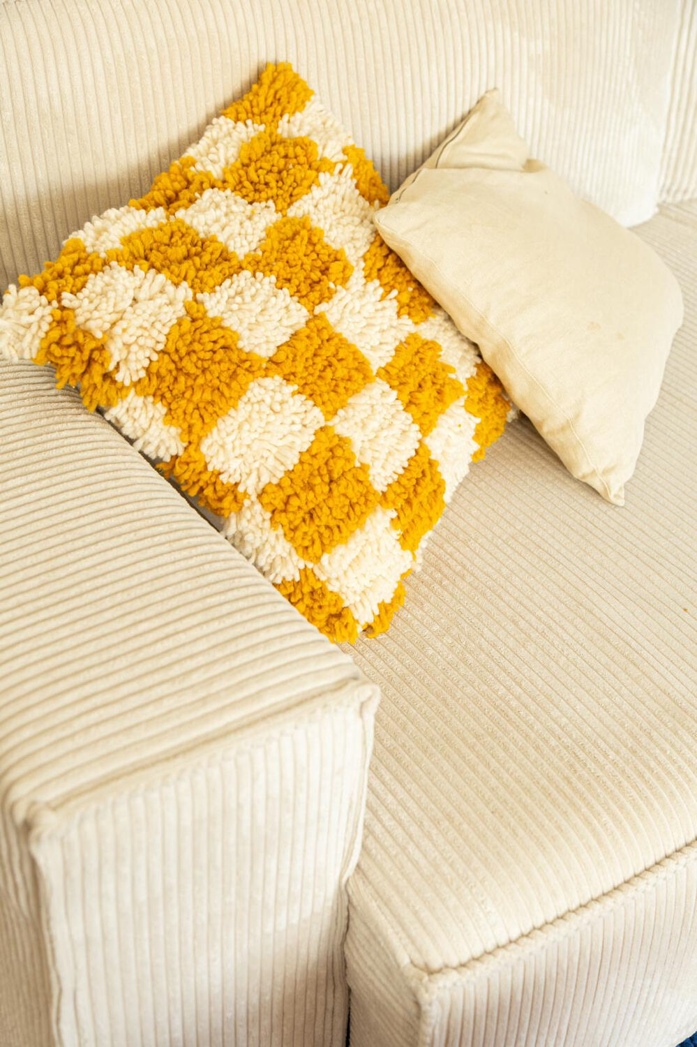 Berber cushion with orange and white checkerboard