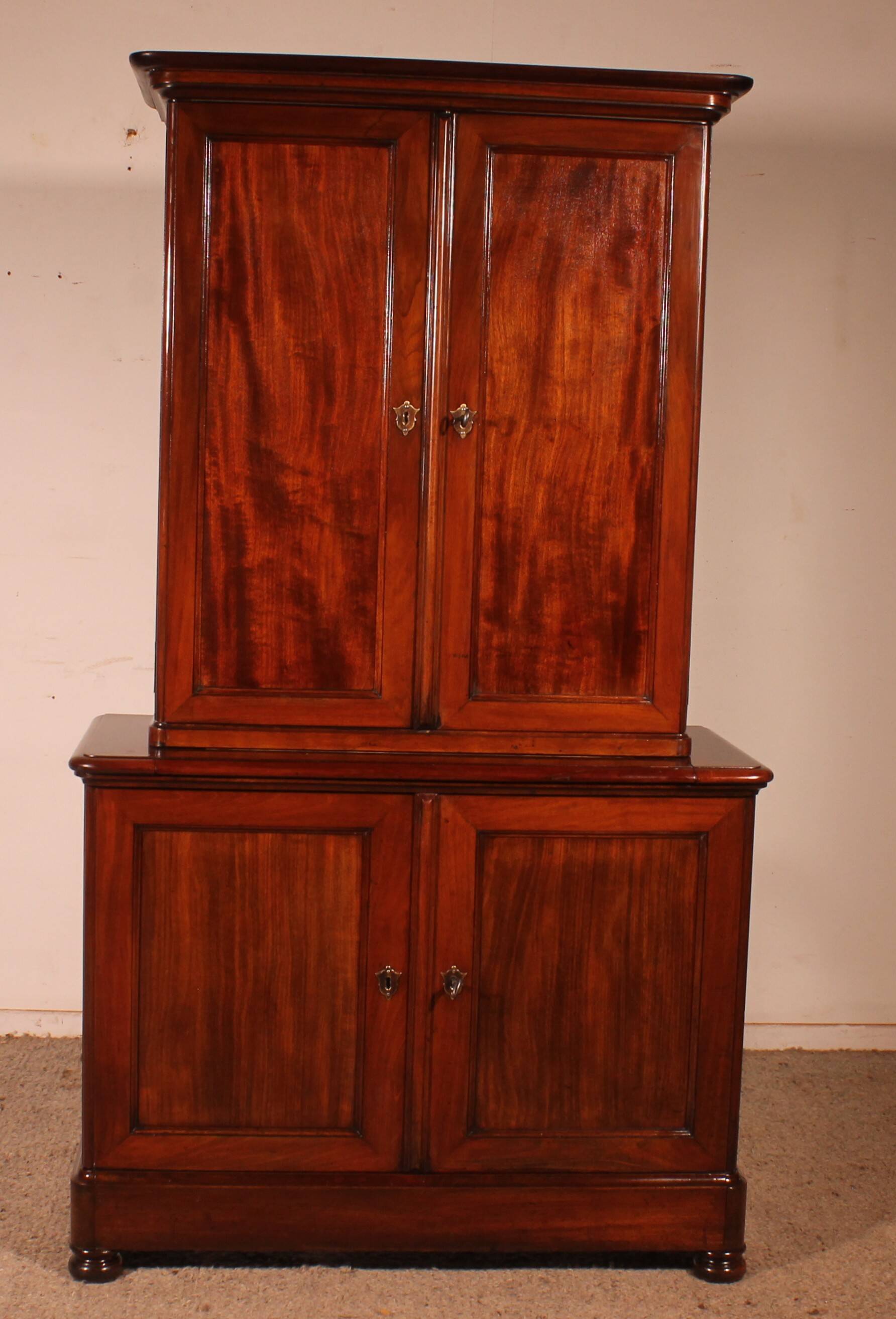 small two-body solid mahogany desk from the early 19th century with writing surface