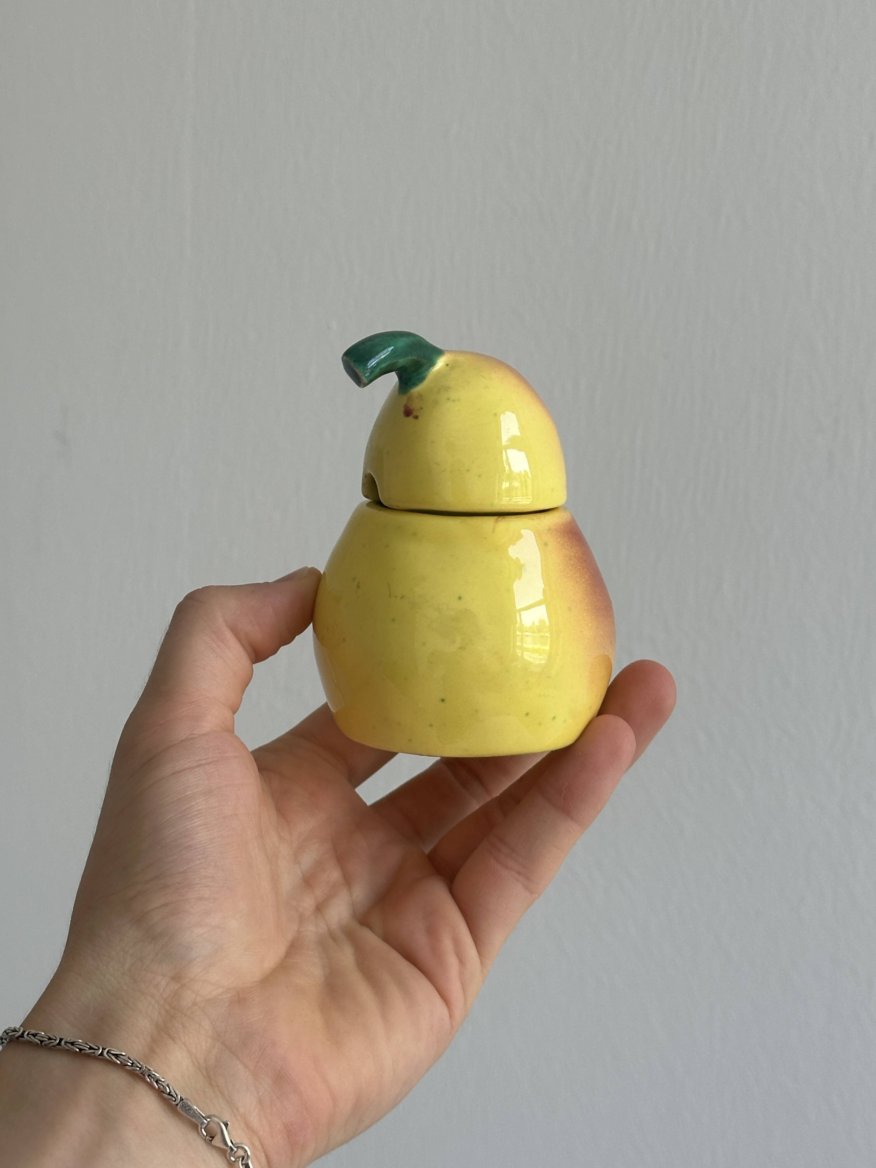 Yellow ceramic pear-shaped salt shaker