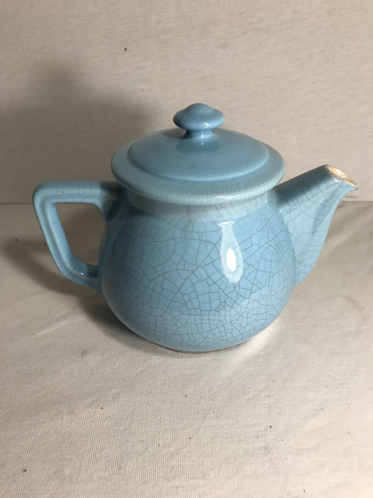 Cracked blue ceramic vintage teapot