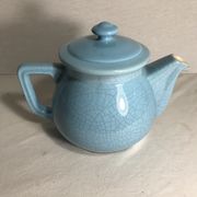Cracked blue ceramic vintage teapot
