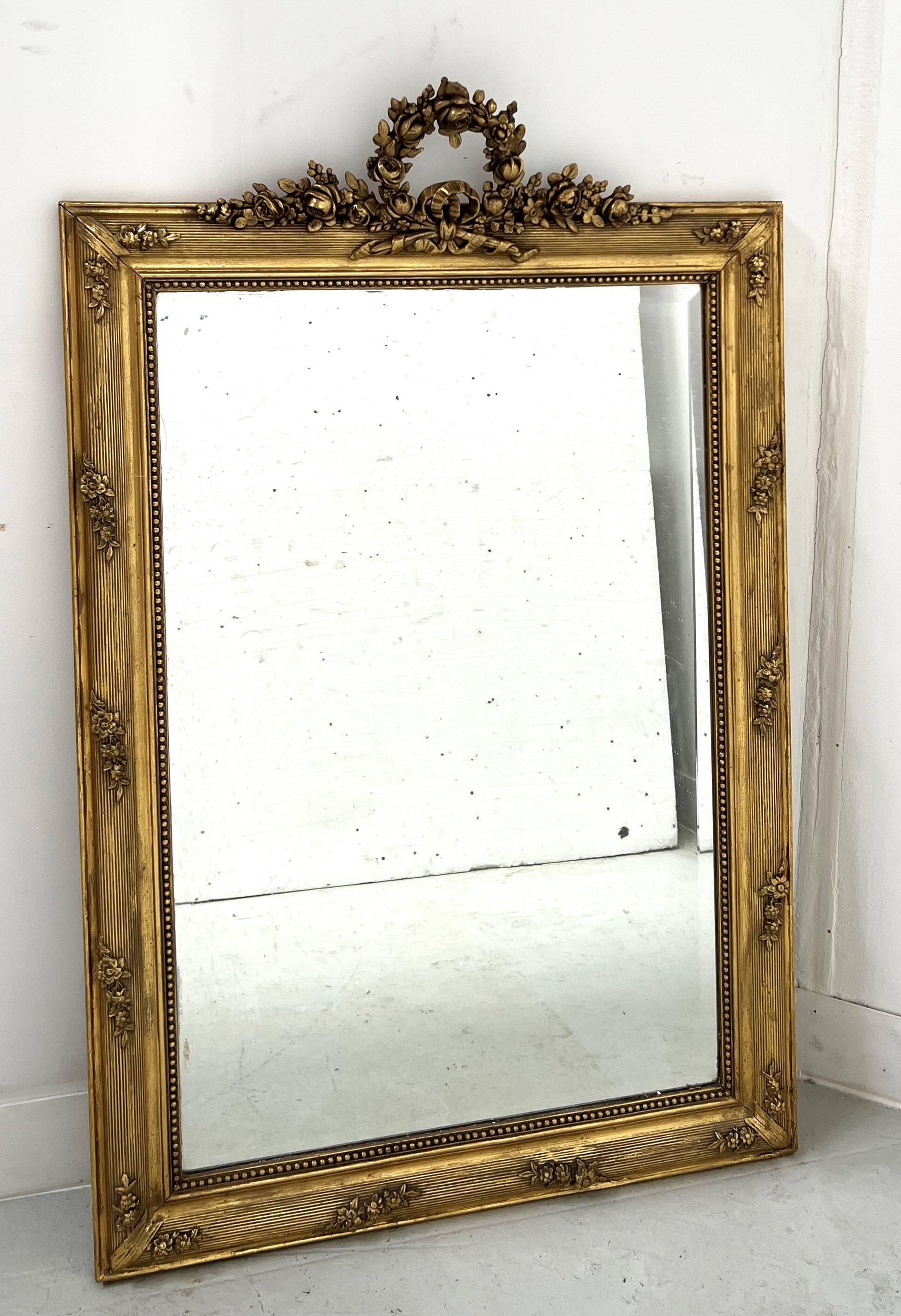 Louis XVI style mirror in wood and gilded stucco, 19th century