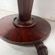 Empire style round table with claw feet, 19th century.