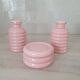 Set of pink and gold ceramic bathroom accessories