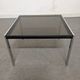 Bedside table or end of sofa in chromed metal and smoked glass from the 70s