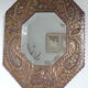 Antique bevelled artisanal mirror in repoussé copper - 54x45cm