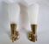 Brass and plexiglass wall lights in the Maison Lunel style.