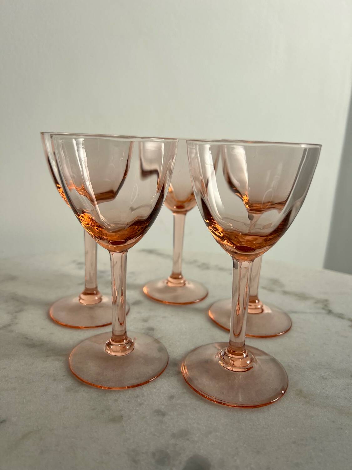 5 small pink glass stemmed glasses