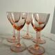 5 small pink glass stemmed glasses
