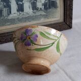 Old bowl in earthenware with floral decoration.