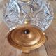 Footed catch-all / ashtray with cherub (glass and gilded metal)