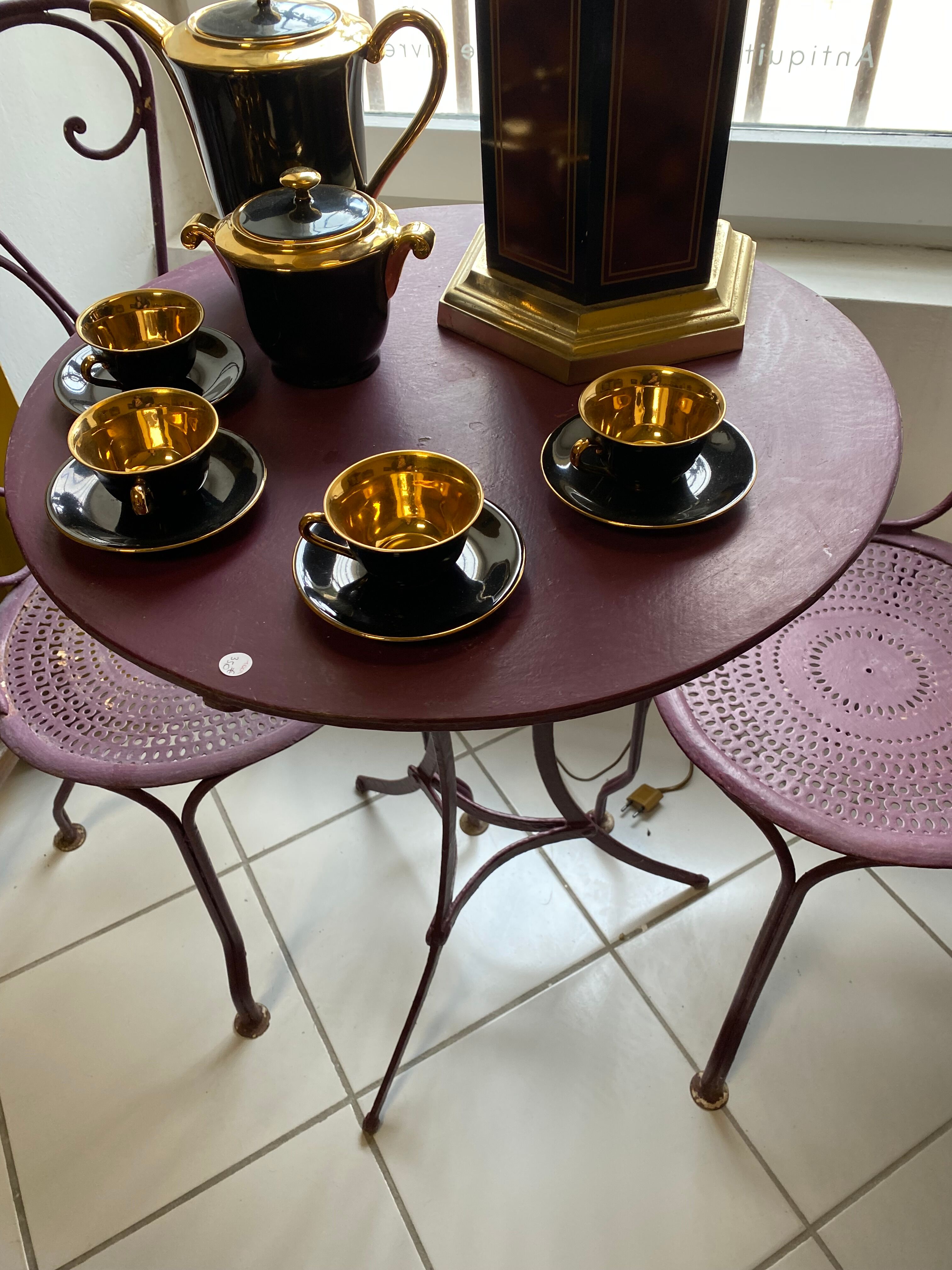 Set of two chairs and wrought iron pedestal table