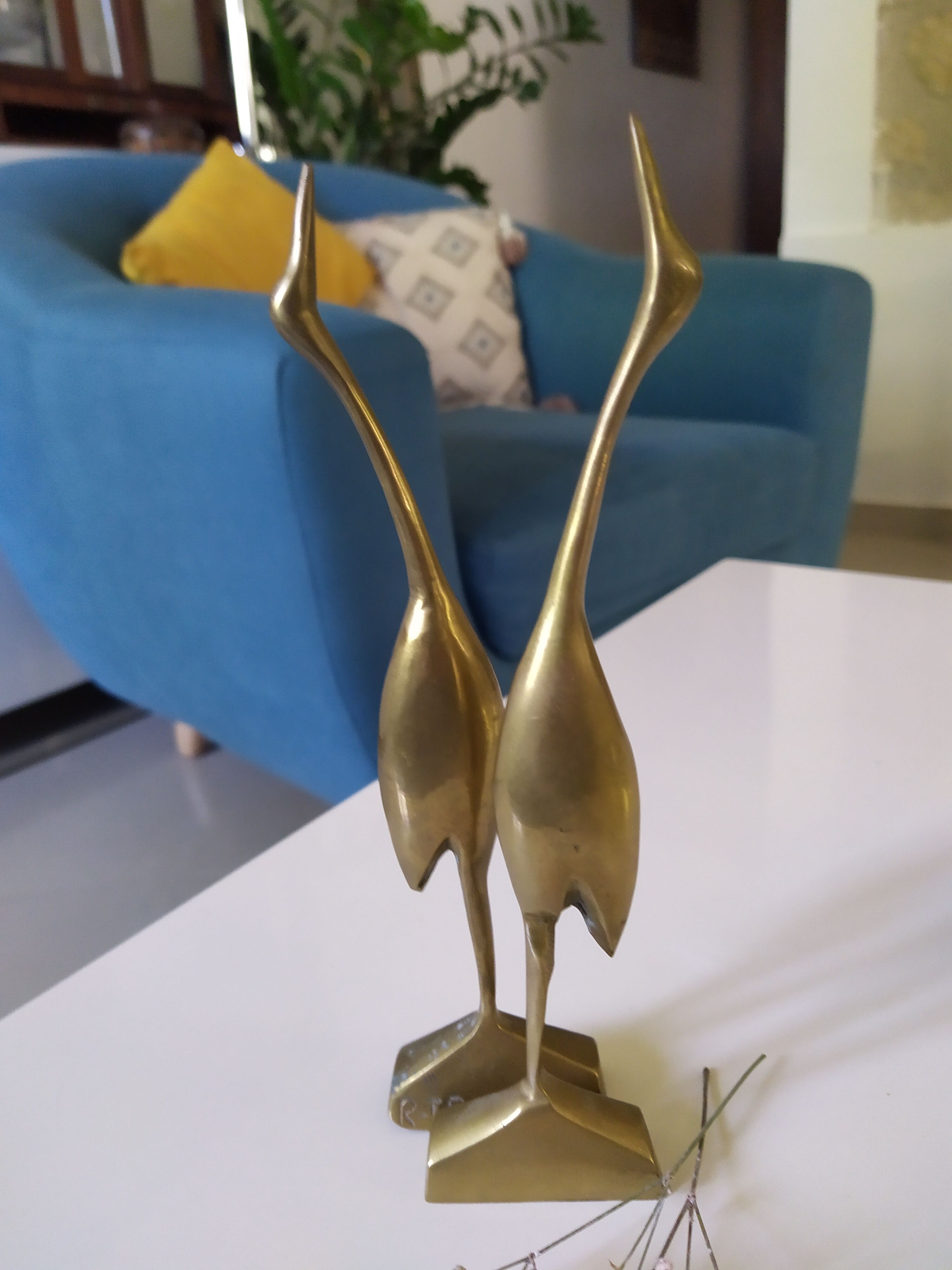 Coupled with brass herons