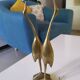 Coupled with brass herons